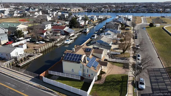an aerial view of a house with a lake view