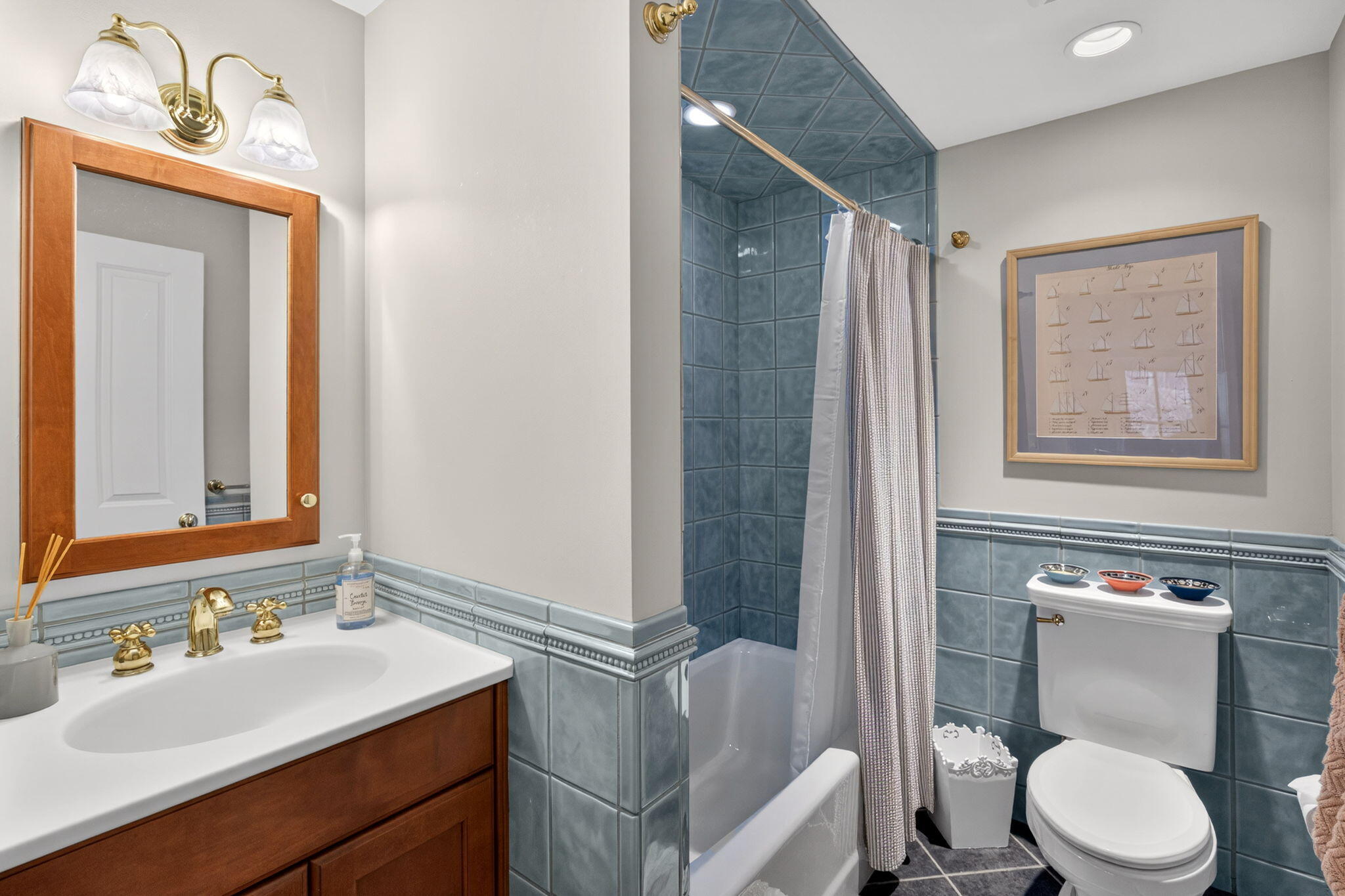 35 Northgate Road North Chatham, MA 02650 - Photo 53 of 75 a bathroom with a sink a toilet a mirror and shower