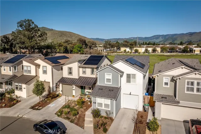 an aerial view of a house with a big yard