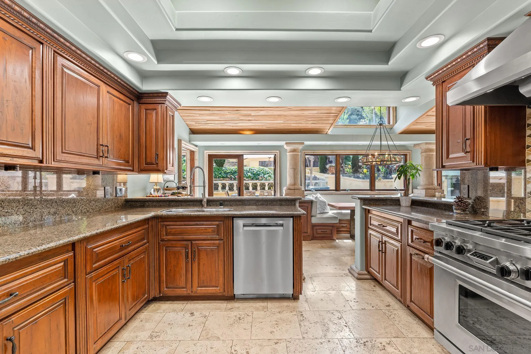 2969 Racetrack View Drive Del Mar, CA 92014 - Photo 20 of 59 a kitchen with lots of counter top space and wooden floor