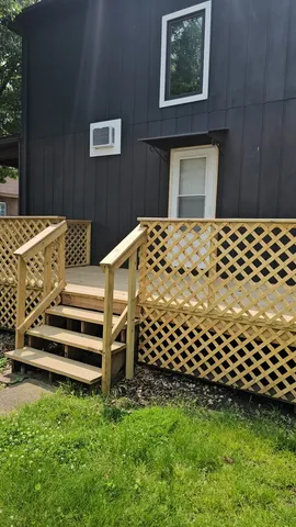 a view of terrace with wooden floor and fence