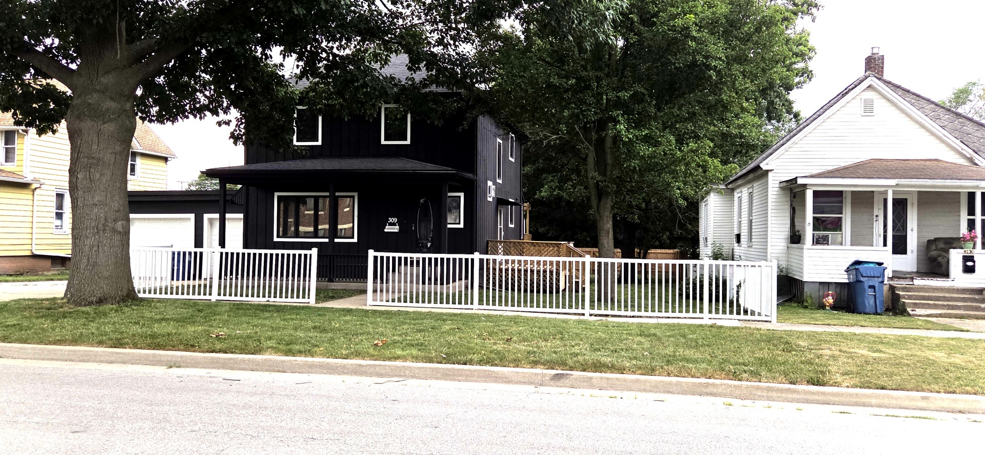 309 North Market Street Hoopeston, IL 60942 - Photo 2 of 45 a front view of a house with a garden and yard