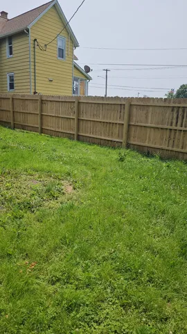 a view of park with a fence