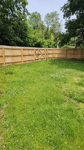 a wooden bench sitting in front of a building