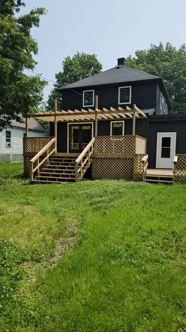 a view of outdoor space with wooden bridge