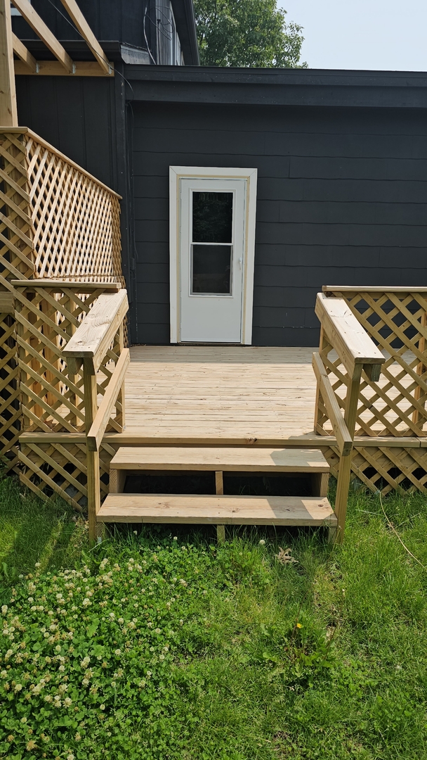 309 North Market Street Hoopeston, IL 60942 - Photo 30 of 45 a wooden bench sitting in front of a building