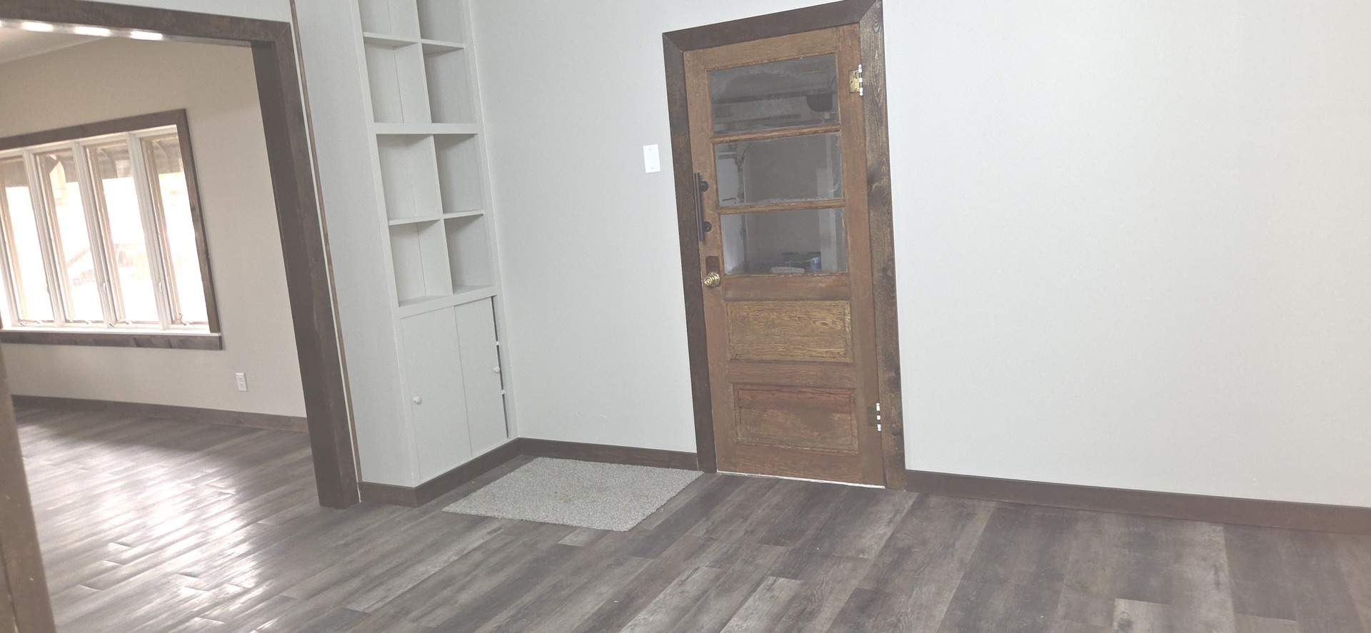 309 North Market Street Hoopeston, IL 60942 - Photo 5 of 45 an empty room with wooden floor closet and windows