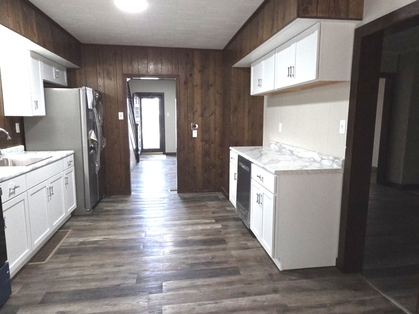 309 North Market Street Hoopeston, IL 60942 - Photo 7 of 45 a kitchen with stainless steel appliances granite countertop a white stove top oven and refrigerator