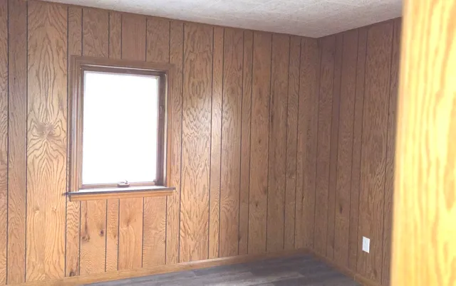 a view of front door with wooden floor