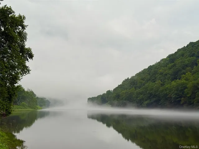 a view of a lake with a yard