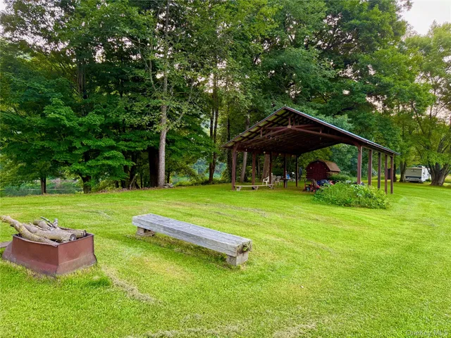 a view of a table and chairs in the garden