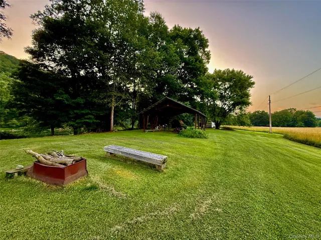 a view of a table and chairs in the garden