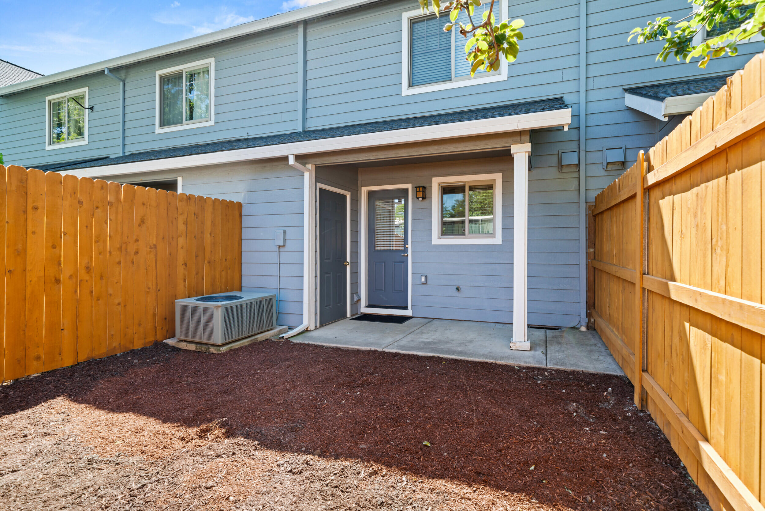 450 Midway Road, Unit 33 Medford, OR 97501 - Photo 20 of 21 a view of a house with a door and wooden walls