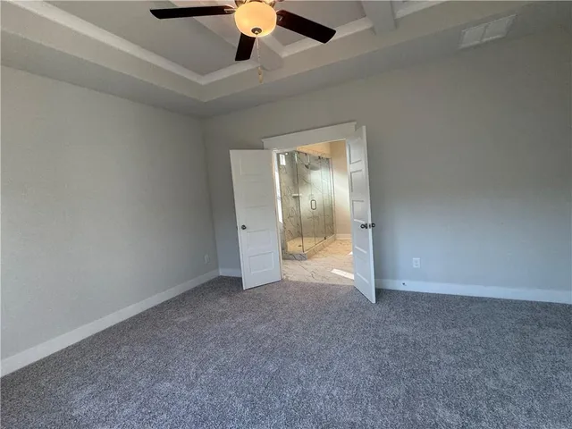 an empty room with a bathroom