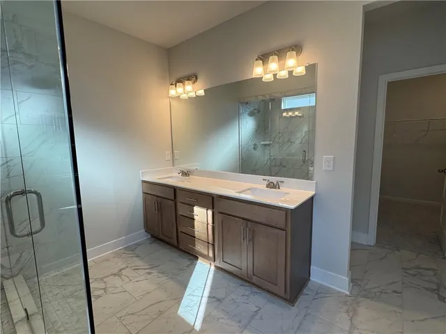 a bathroom with a sink and mirror