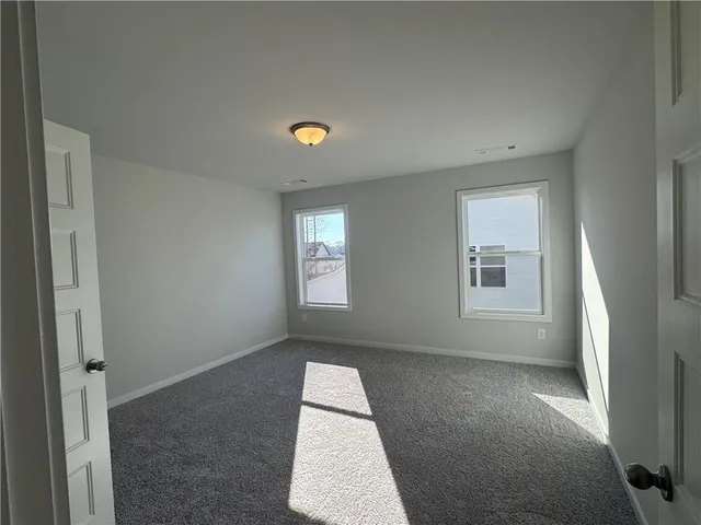 an empty room with windows