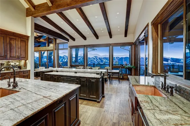 a kitchen with a stove sink and cabinets