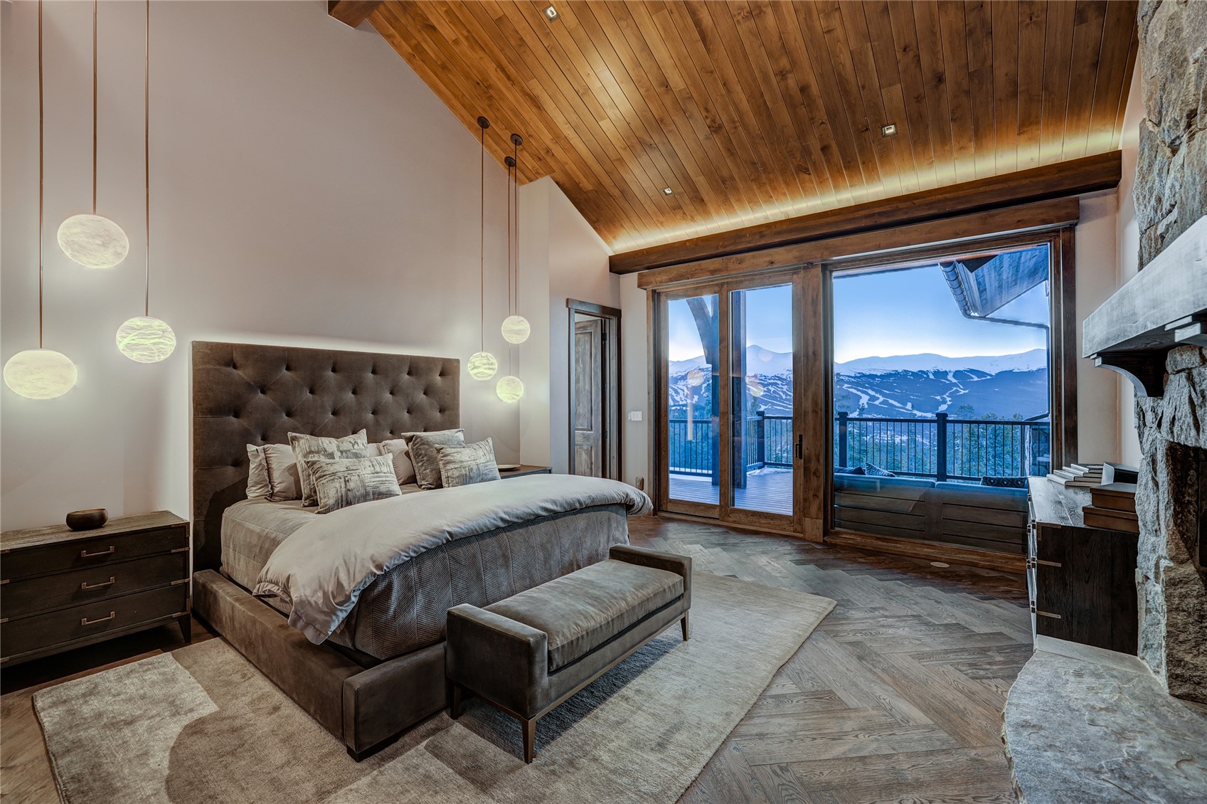 250 Sallie Barber Road Breckenridge, CO 80424 - Photo 24 of 50 a bedroom with a large bed and a balcony view