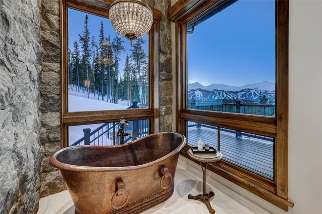a spacious bathroom with double vanity and a bathtub