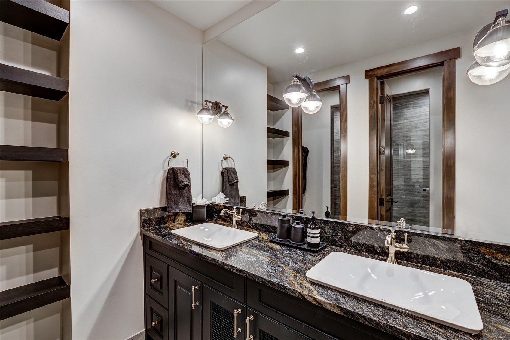 250 Sallie Barber Road Breckenridge, CO 80424 - Photo 43 of 50 a bathroom with double vanity sinks and a mirror