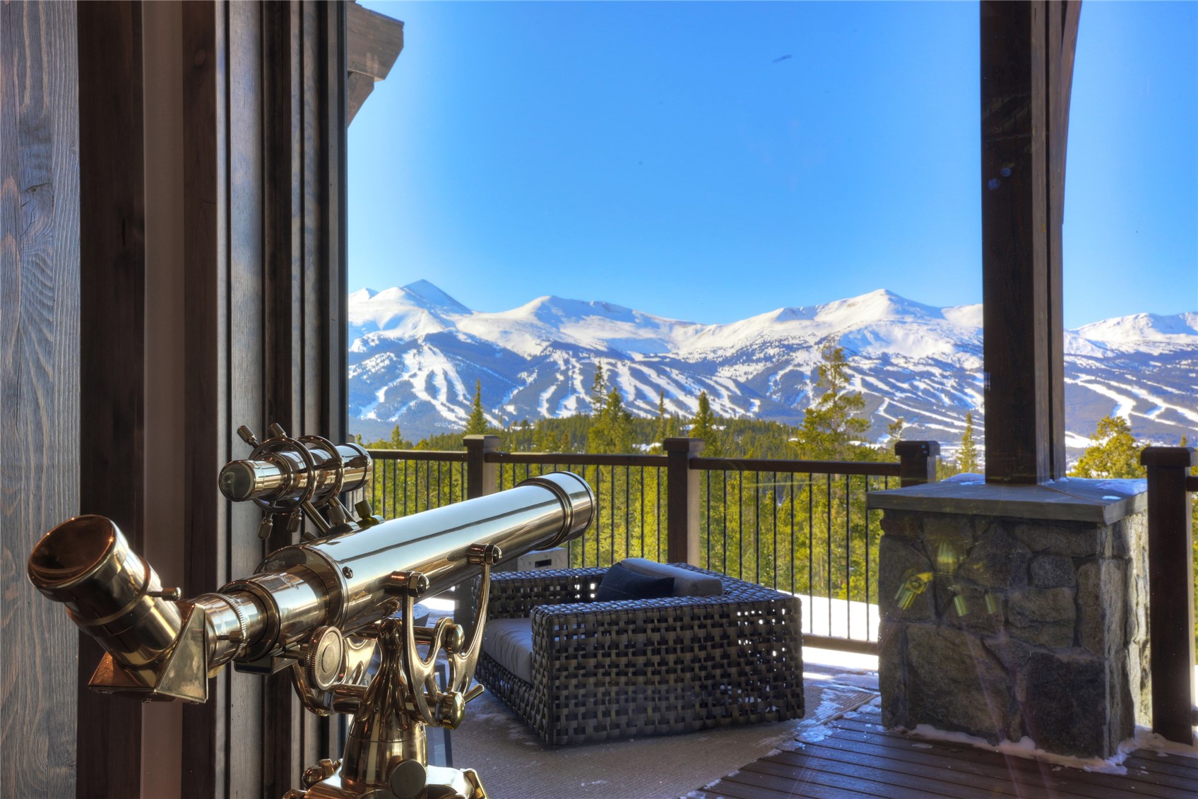 250 Sallie Barber Road Breckenridge, CO 80424 - Photo 10 of 50 a view of a balcony with furniture and a floor to ceiling window