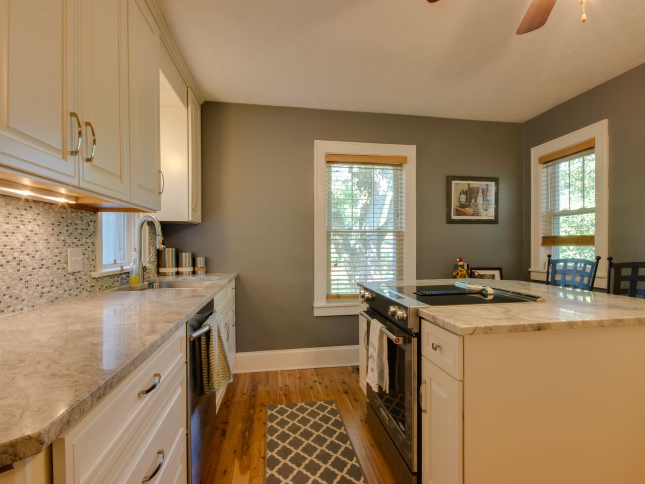 2585 Spaders Church Road Harrisonburg, VA 22801 - Photo 19 of 35 a kitchen with a stove sink and cabinets