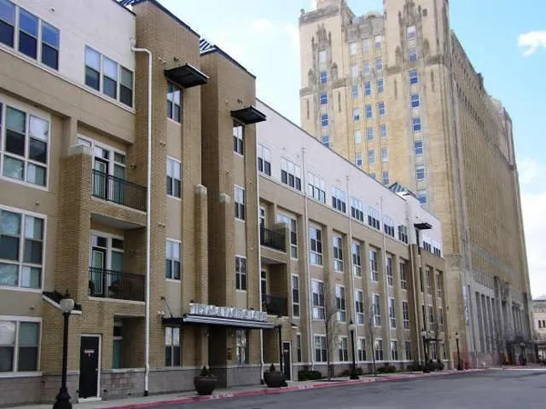 a view of a building with a street