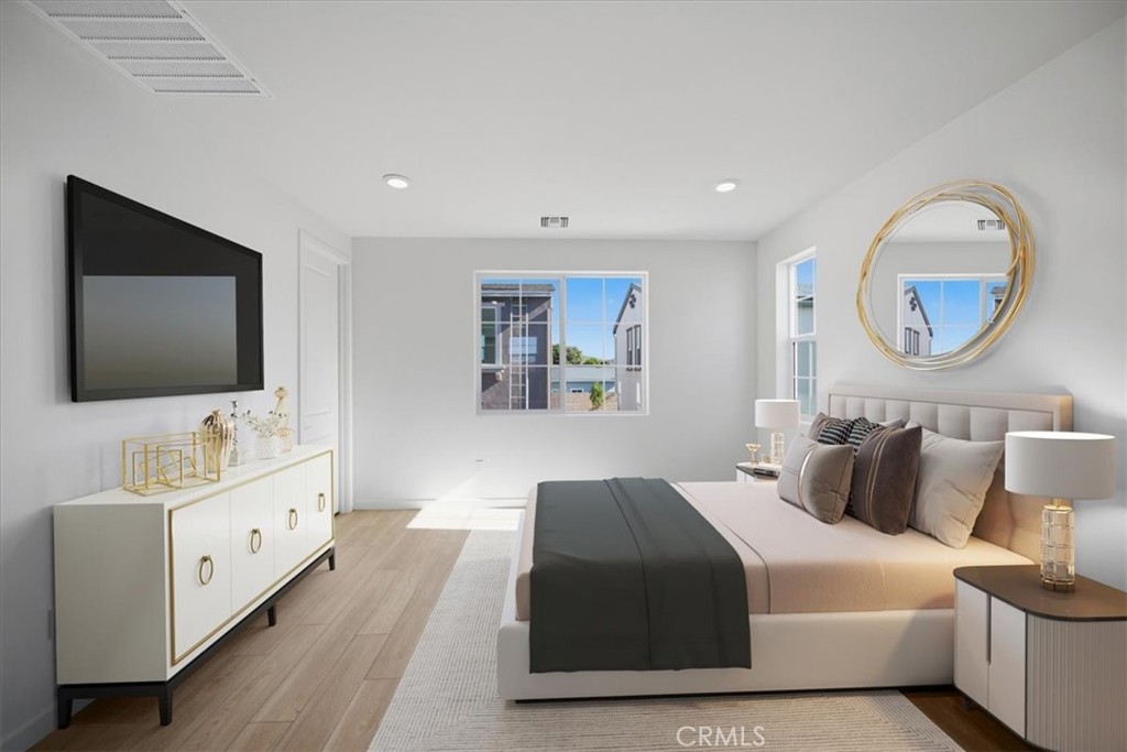 4852 Arroyo Run Moorpark, CA 93021 - Photo 15 of 39 a bedroom with a bed and a flat screen tv