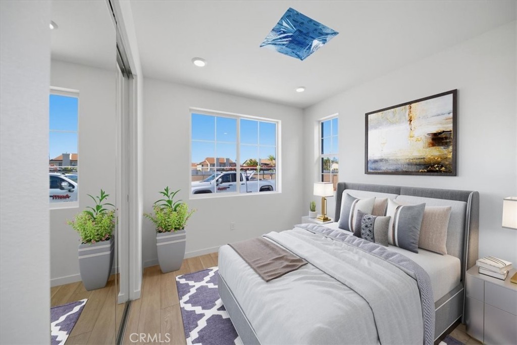 4852 Arroyo Run Moorpark, CA 93021 - Photo 26 of 39 a bedroom with a bed and a painting on the wall