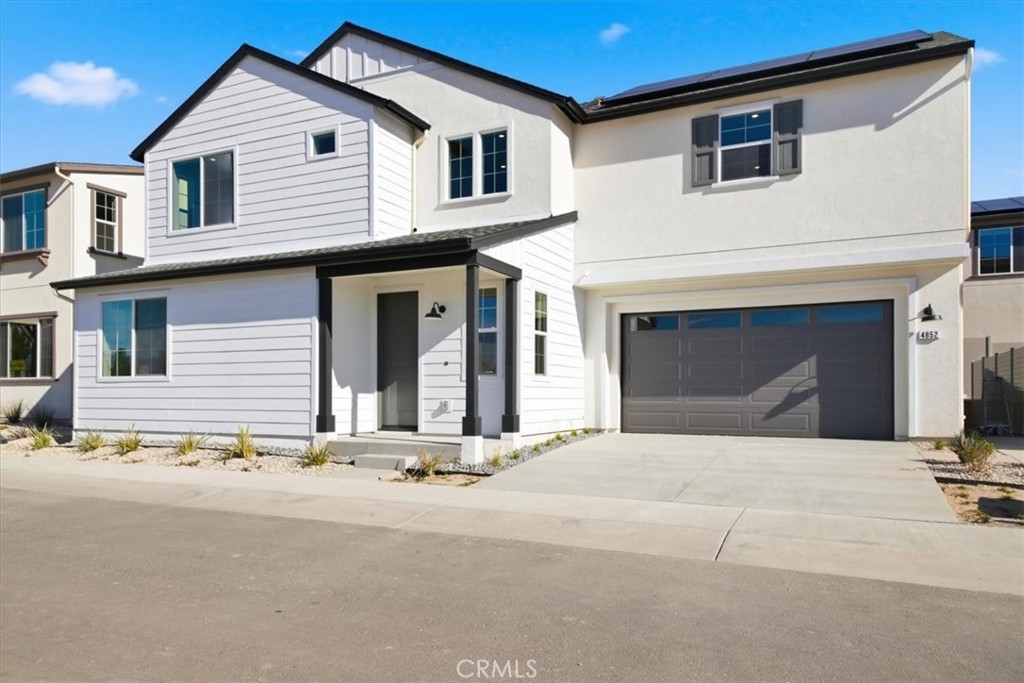 4852 Arroyo Run Moorpark, CA 93021 - Photo 3 of 39 a view of a white house with a large windows