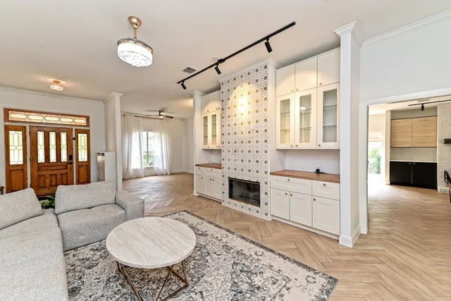 a living room with furniture windows and a fireplace