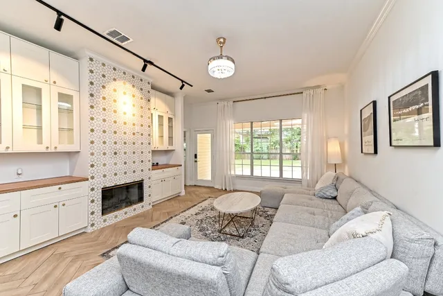 a living room with furniture and a large window