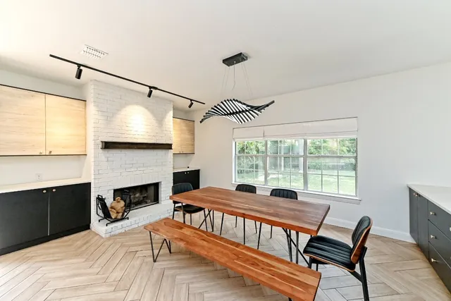 a bedroom with a bed and a fireplace