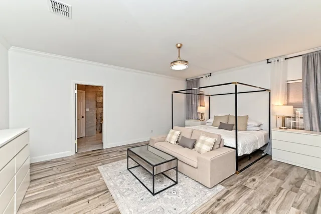 a bedroom with a bed and window