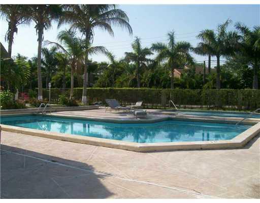 8601 Southwest 94th Street, Unit 201W Miami, FL 33156 - Photo 11 of 14 a view of swimming pool with a yard