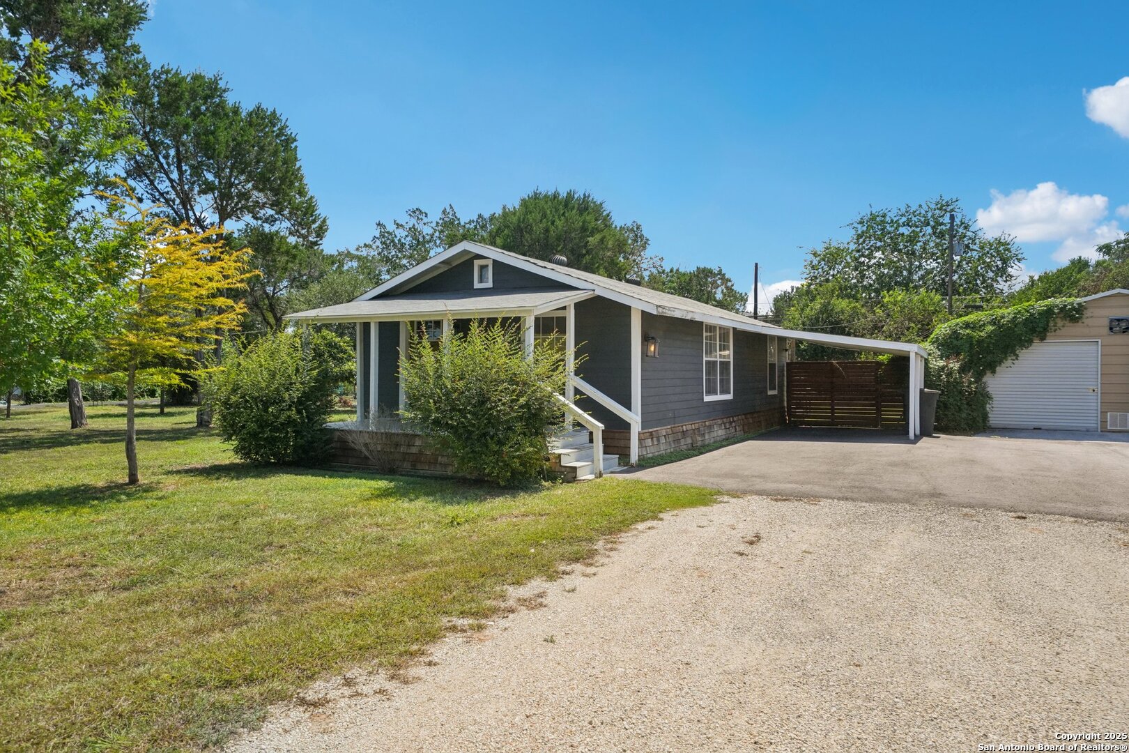 1038 Plateau Ridge New Braunfels, TX 78132 - Photo 2 of 18 a front view of a house with garden