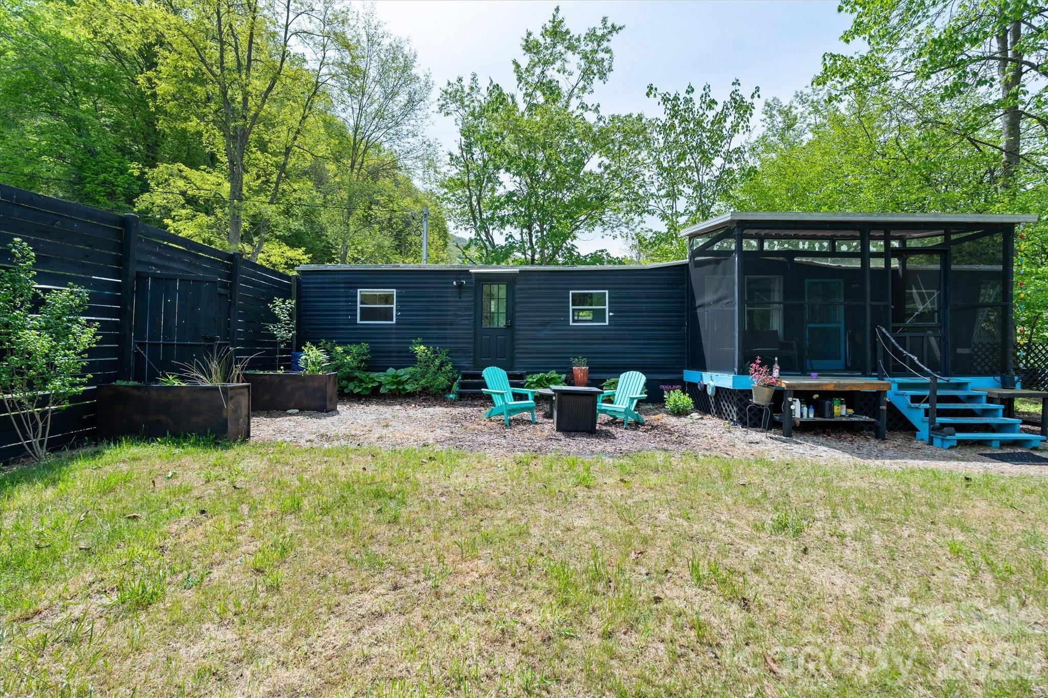 72 Amos Creek Road Marshall, NC 28753 - Photo 14 of 28 a view of a house with backyard and sitting area
