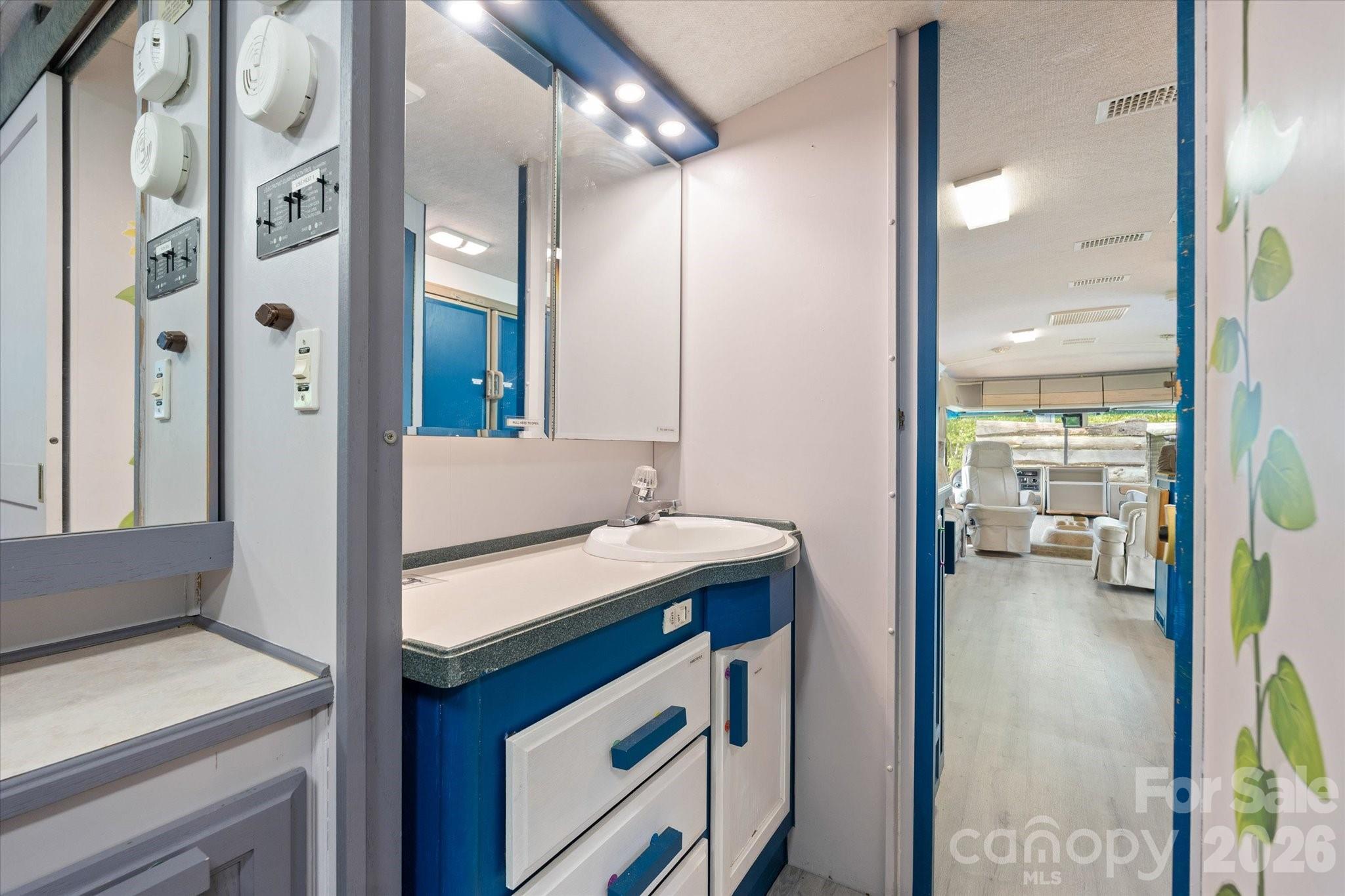 72 Amos Creek Road Marshall, NC 28753 - Photo 20 of 28 a kitchen with a sink and a refrigerator