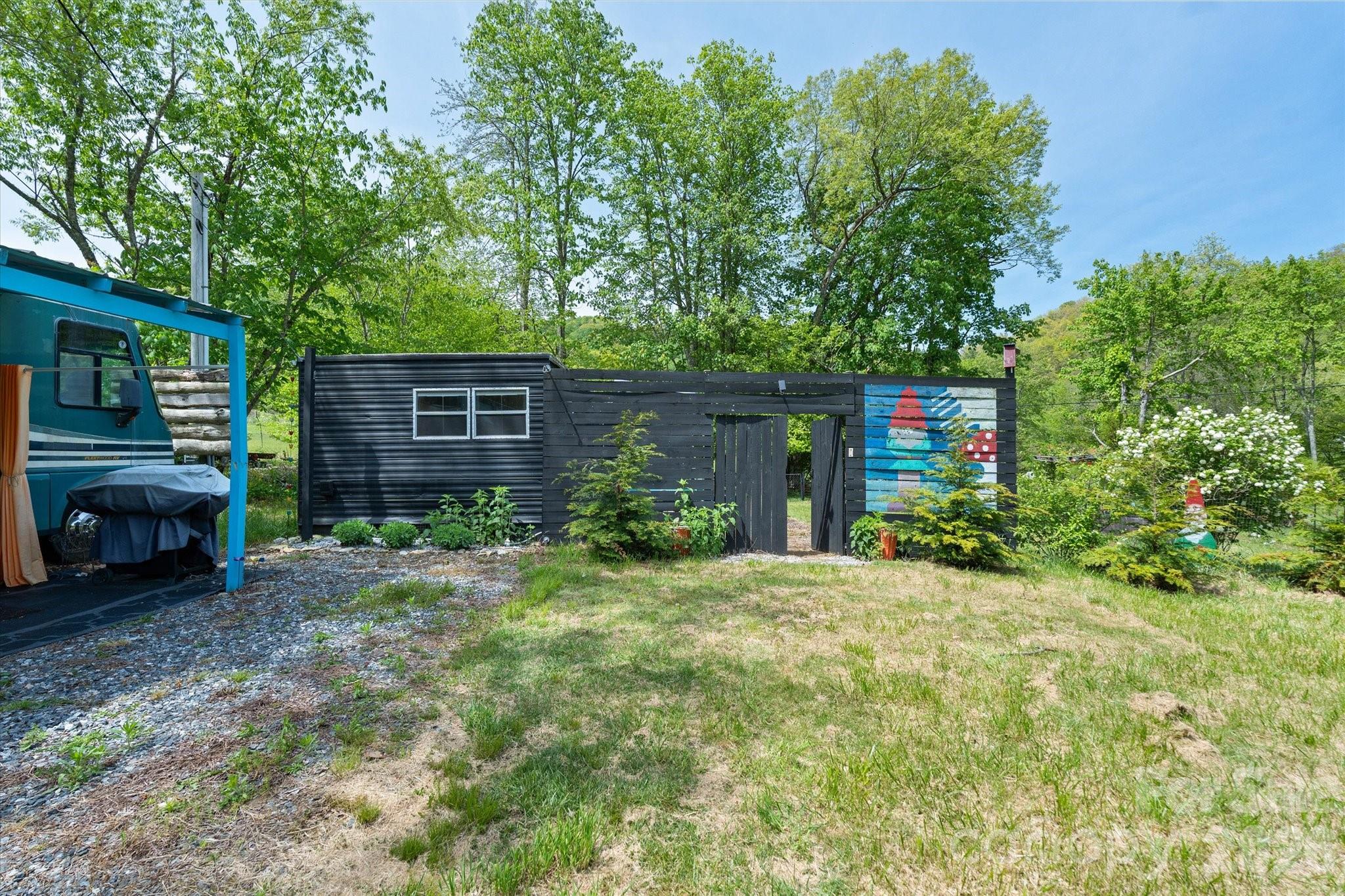 72 Amos Creek Road Marshall, NC 28753 - Photo 2 of 28 a view of a house with a yard and sitting area