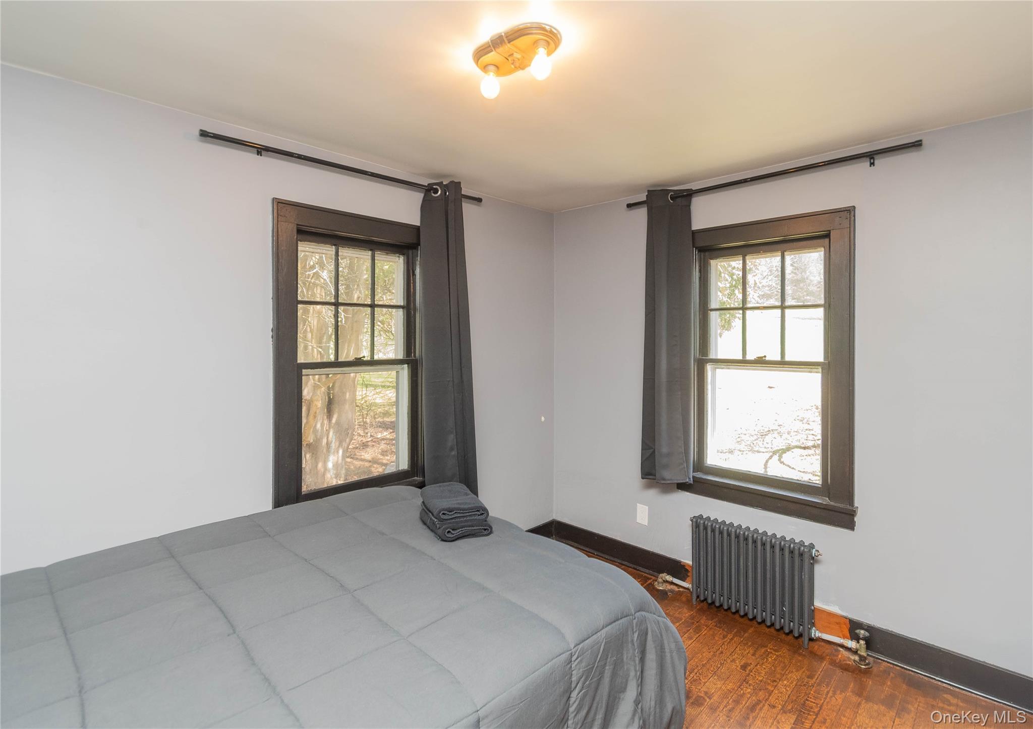 680 Old Rte 17 Livingston Manor, NY 12758 - Photo 15 of 29 a bedroom with a bed and a window