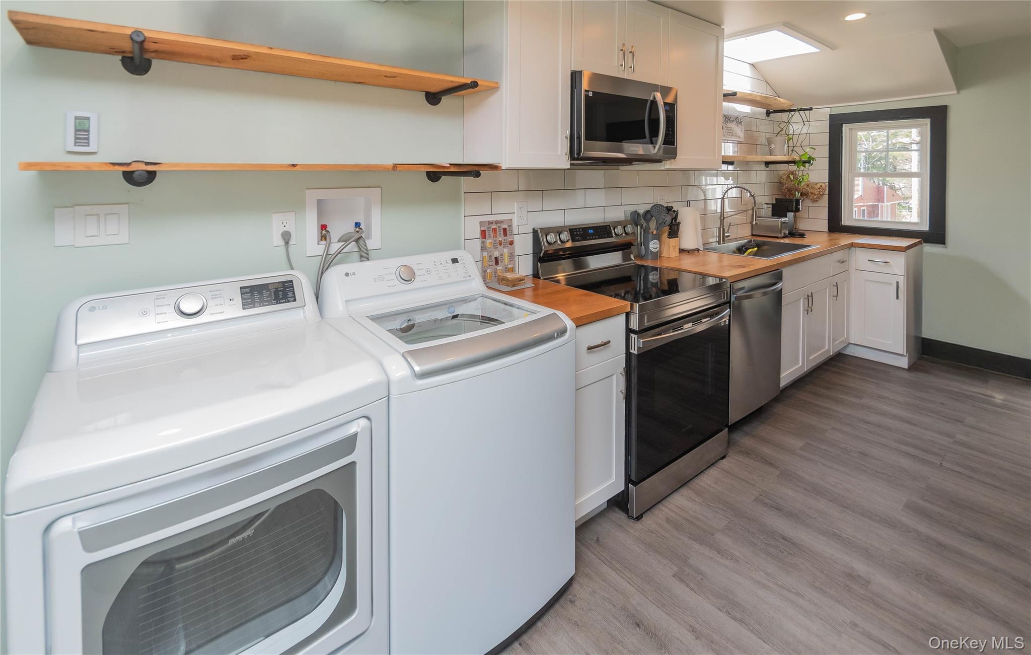 680 Old Rte 17 Livingston Manor, NY 12758 - Photo 5 of 29 a kitchen with a stove top oven sink and cabinets