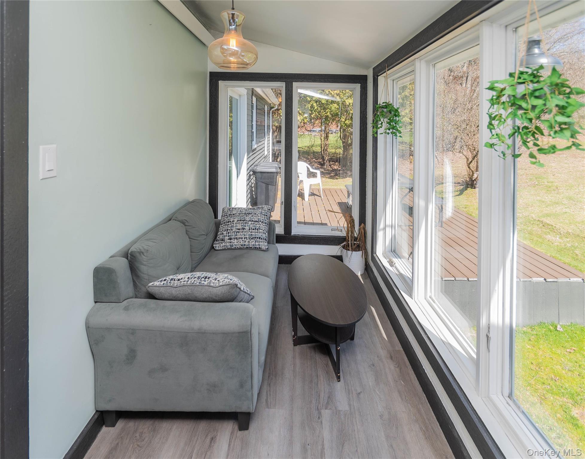 680 Old Rte 17 Livingston Manor, NY 12758 - Photo 7 of 29 a living room with furniture and a large window