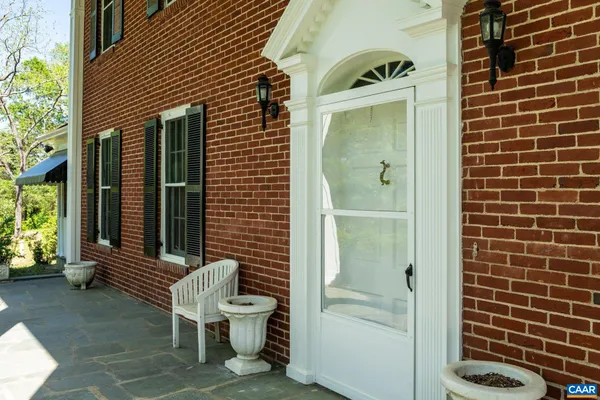 a view of a door and chair in the room