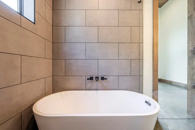 a bathroom with a granite countertop toilet sink and shower