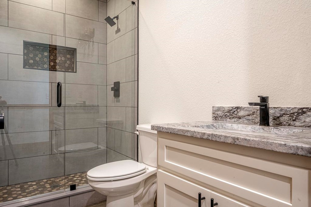 86 Valley Lake Road Mineral Bluff, GA 30559 - Photo 20 of 59 a bathroom with a granite countertop toilet sink and shower