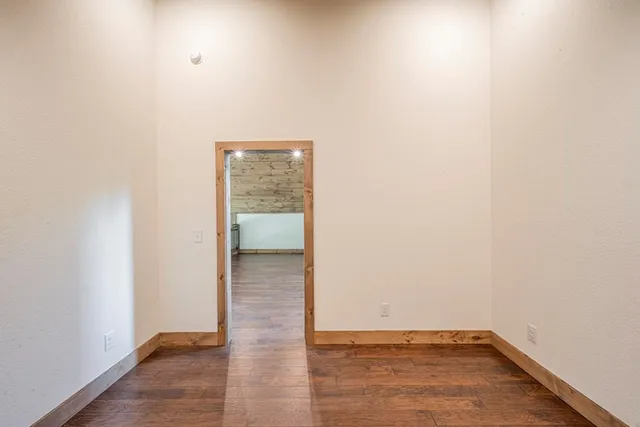 a bathroom with a granite countertop sink a toilet and shower