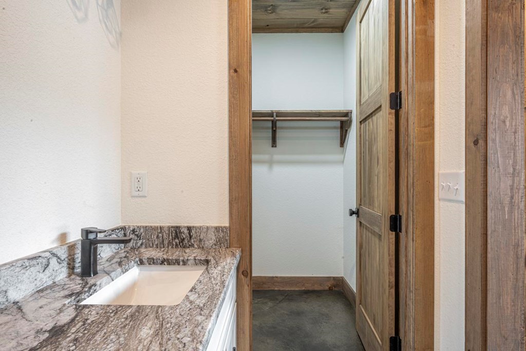 86 Valley Lake Road Mineral Bluff, GA 30559 - Photo 45 of 59 a bathroom with a granite countertop sink and mirror