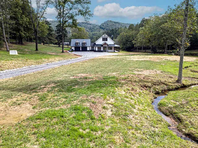 a living room with furniture fireplace and flat screen tv
