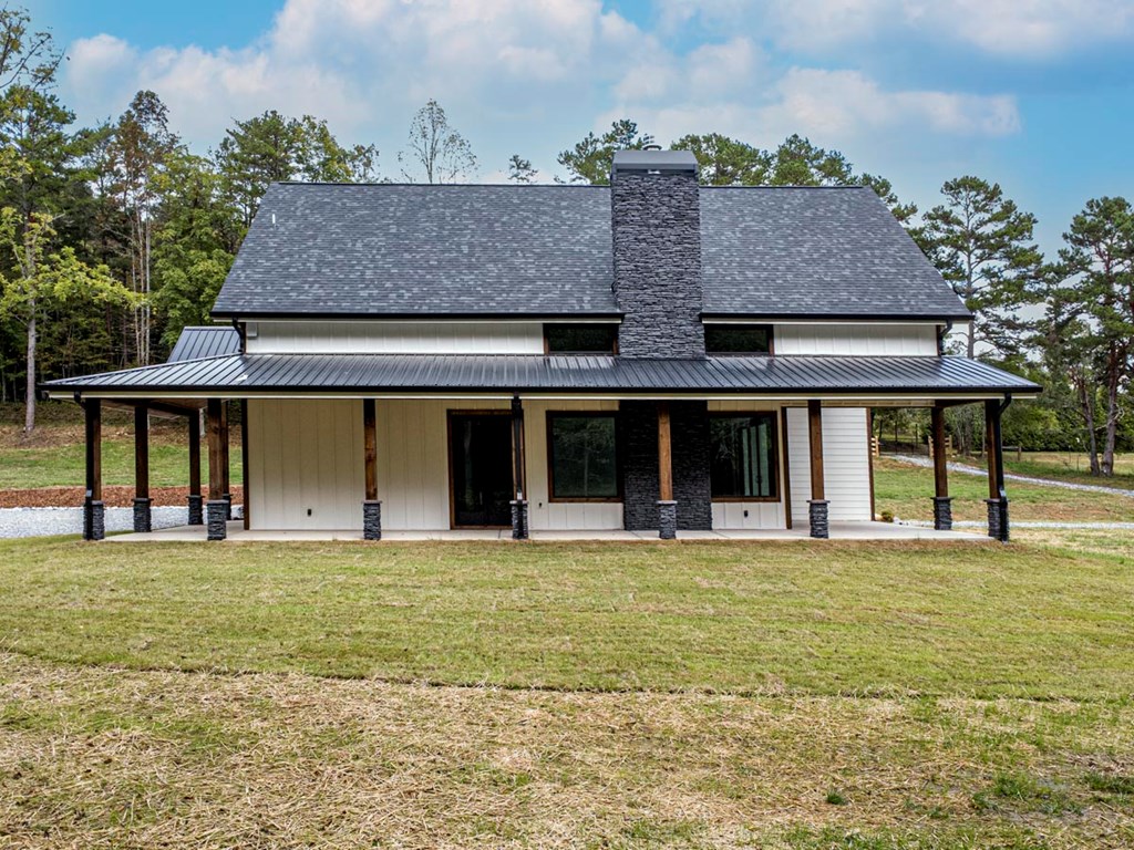 86 Valley Lake Road Mineral Bluff, GA 30559 - Photo 49 of 59 a view of a large building with a big yard