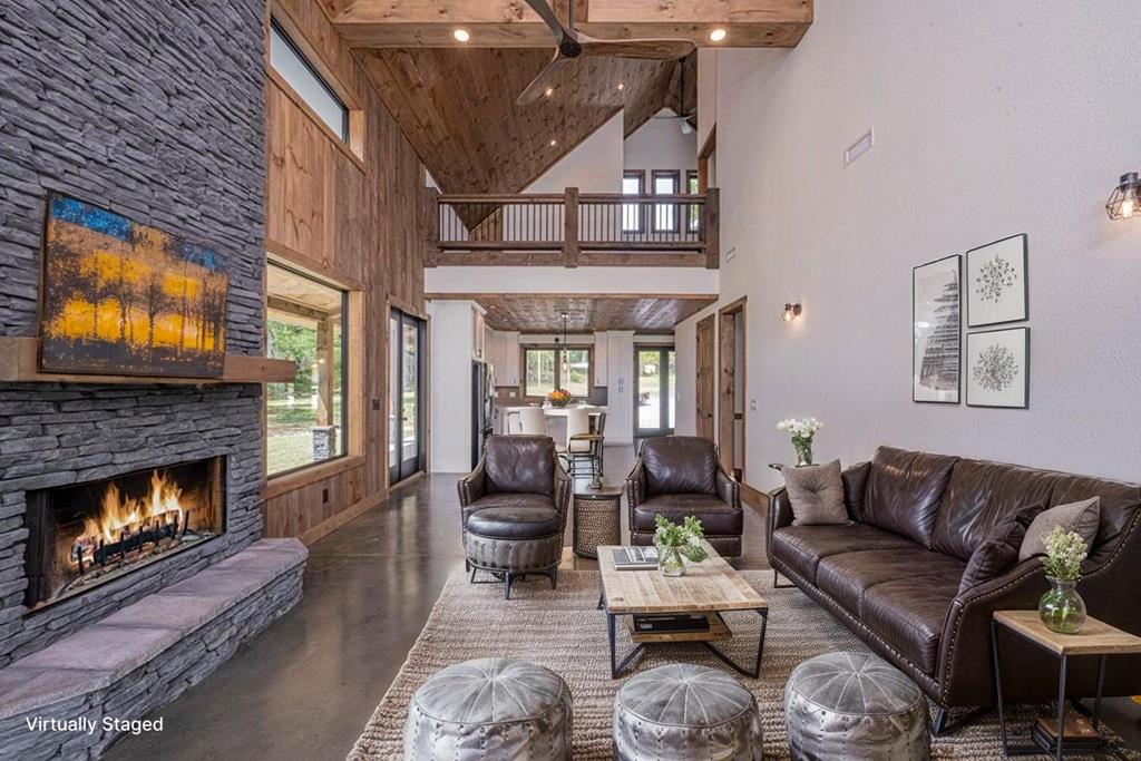 86 Valley Lake Road Mineral Bluff, GA 30559 - Photo 56 of 59 a living room with furniture and a fireplace